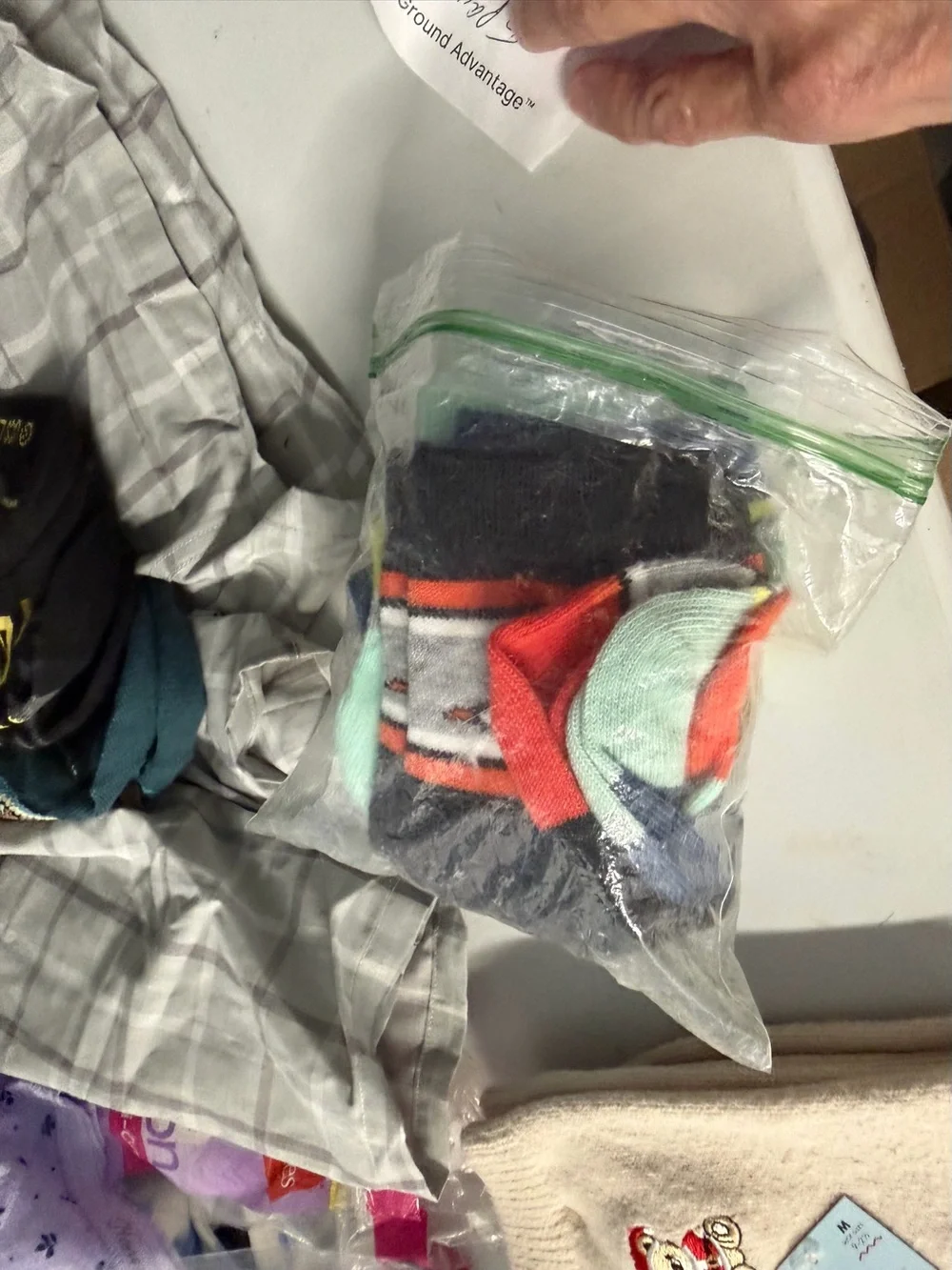 Five pair of boys socks, unbranded open package 6 inches from toe to heel